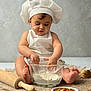 baby, child, chef_hat, apron, flour, glass_bowl, rolling_pin, barefoot, sitting, cooking, kitchen, food, dough, cute, messy, infant, table, wooden_spoon, vegetables, homemade