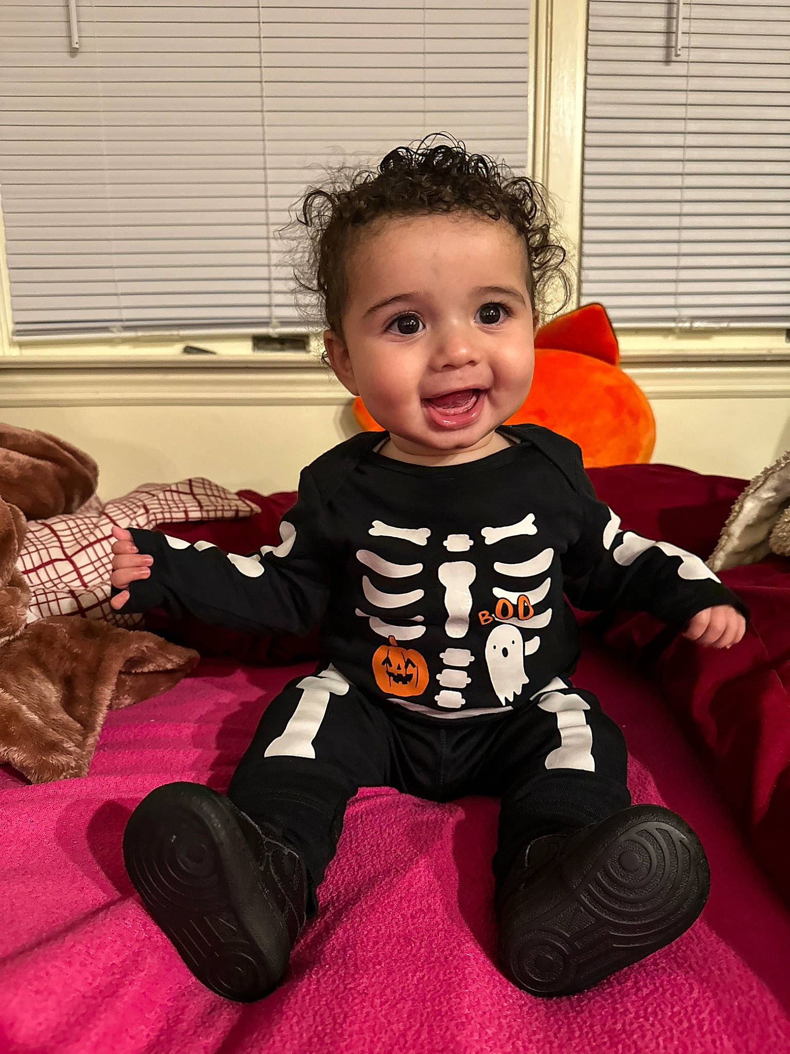 Anthony Jr is registered to the contest to win money with this photo: baby, baby_toddler_clothing, carmine, child, comfort, eye, facial_expression, flooring, fun, hairstyle, happy, head, joy, person, room, sitting, sleeve, smile, t_shirt, toddler
