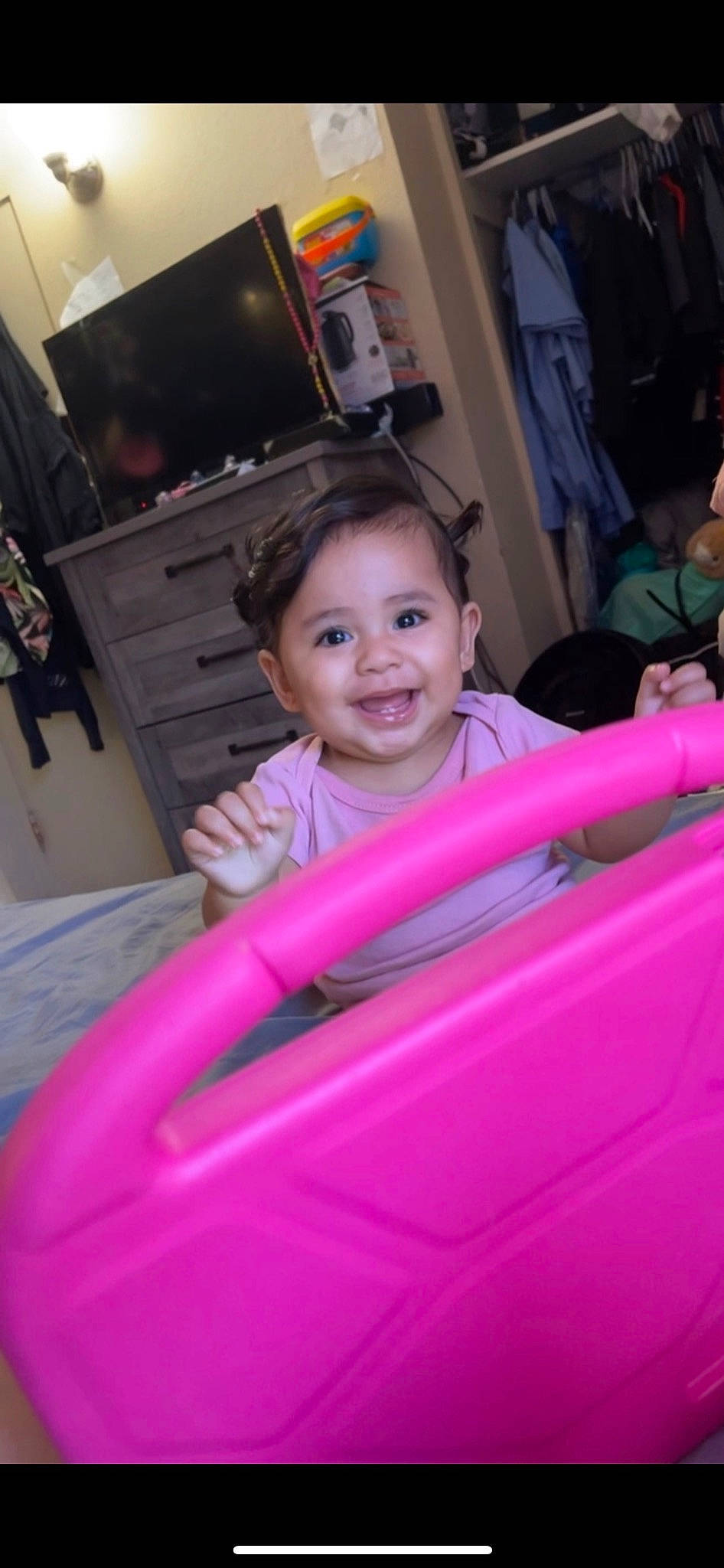 Nyla is registered to the contest to win money with this photo: automotive_design, automotive_exterior, child, comfort, entertainment_center, event, eye, flooring, fun, happy, home_appliance, joy, leisure, magenta, person, pink, recreation, sitting, smile, television