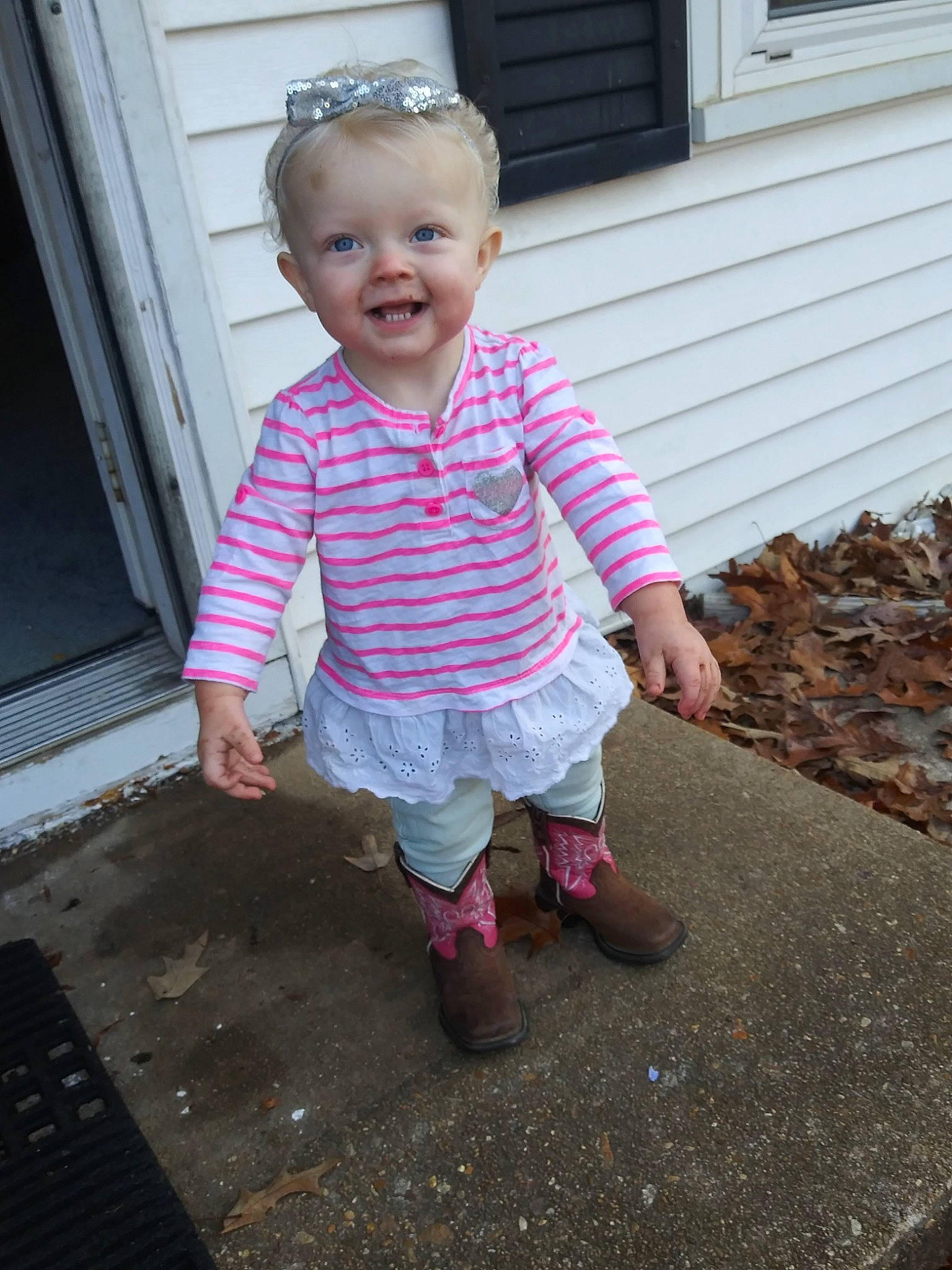 Nevaeh is registered to the contest to win money with this photo: asphalt, baby, baby_toddler_clothing, child, door, eye, flooring, grass, head, joy, magenta, pattern, person, pink, plaid, road_surface, sleeve, smile, t_shirt, tints_and_shades