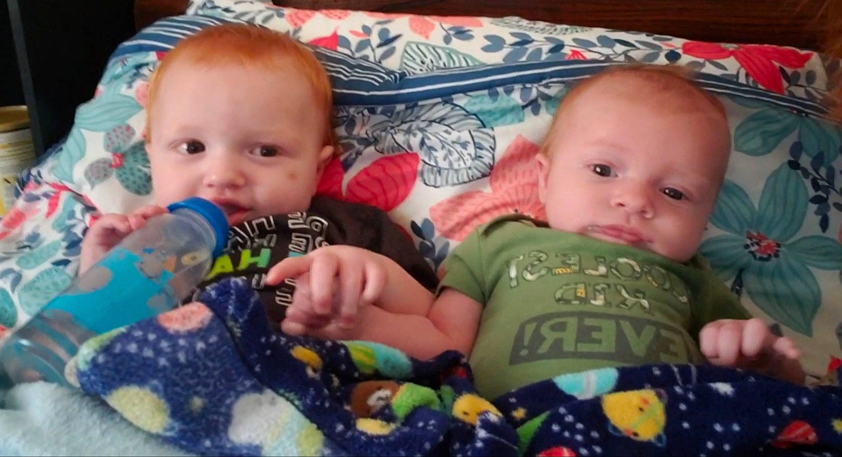 Blayze is registered to the contest to win money with this photo: baby, baby_products, baby_toddler_clothing, cheek, child, fun, green, happy, head, human_body, iris, linens, mouth, nose, organ, person, product, room, skin, textile