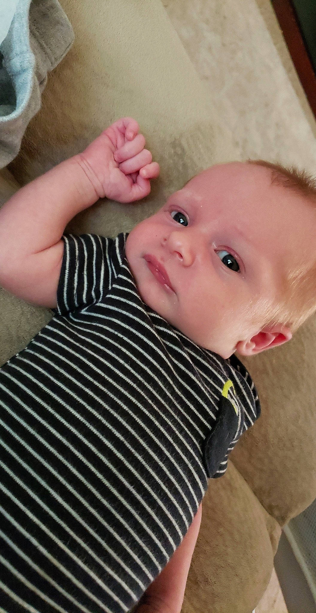 Braxtyn is registered to the contest to win money with this photo: arm, baby_toddler_clothing, cheek, dress, eye, eyelash, face, finger, gesture, hand, head, human_body, iris, lip, mouth, nose, person, pink, skin, sleeve