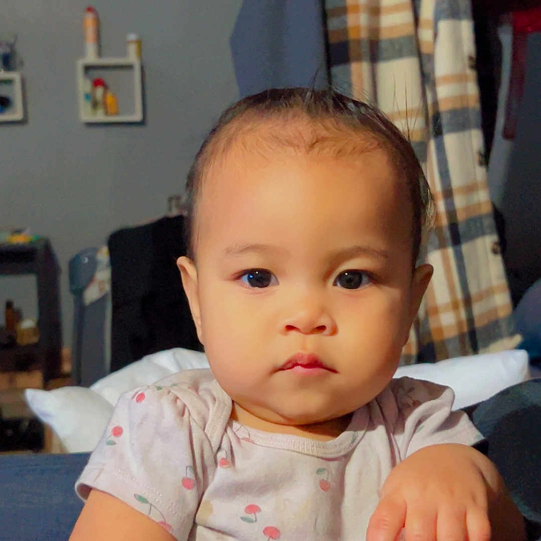 Dativa is registered to the contest to win money with this photo: casual, cherry, child, clothing, couch, expression, face, furniture, hair, hand, home, indoor, pattern, person, portrait, room, shirt, skin, toddler, young_child