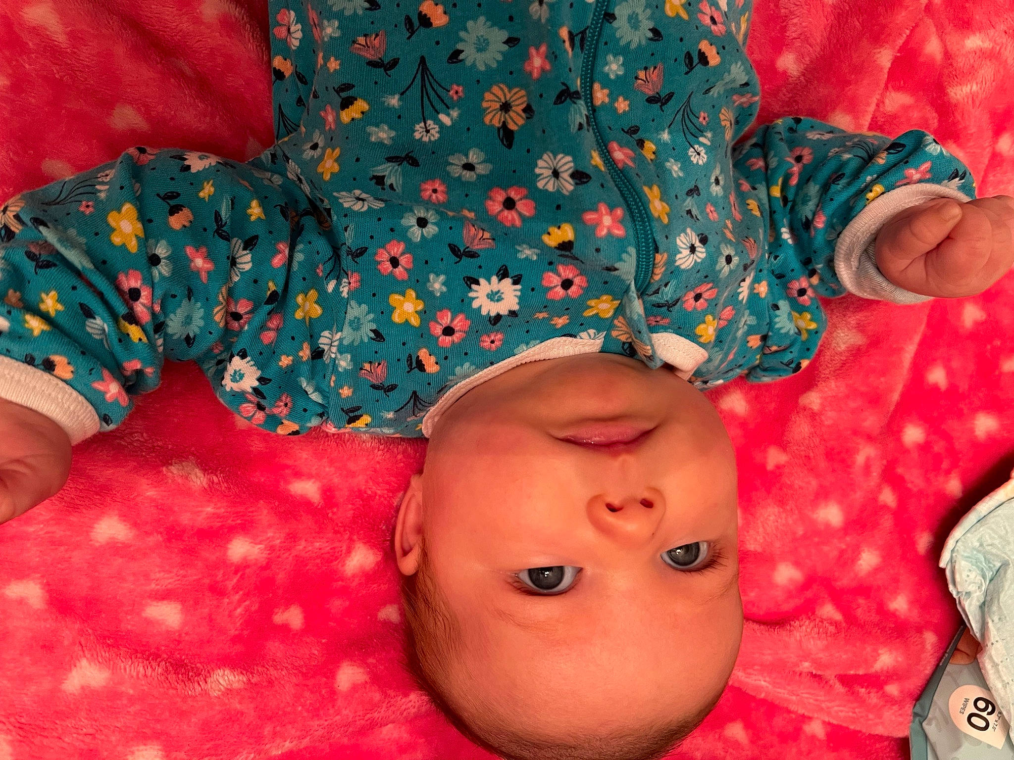 Eliza is registered to the contest to win money with this photo: arm, baby, baby_sleeping, baby_toddler_clothing, cheek, comfort, eyelash, happy, human_body, lip, mouth, nose, orange, pattern, person, pink, red, sleeve, textile, toddler