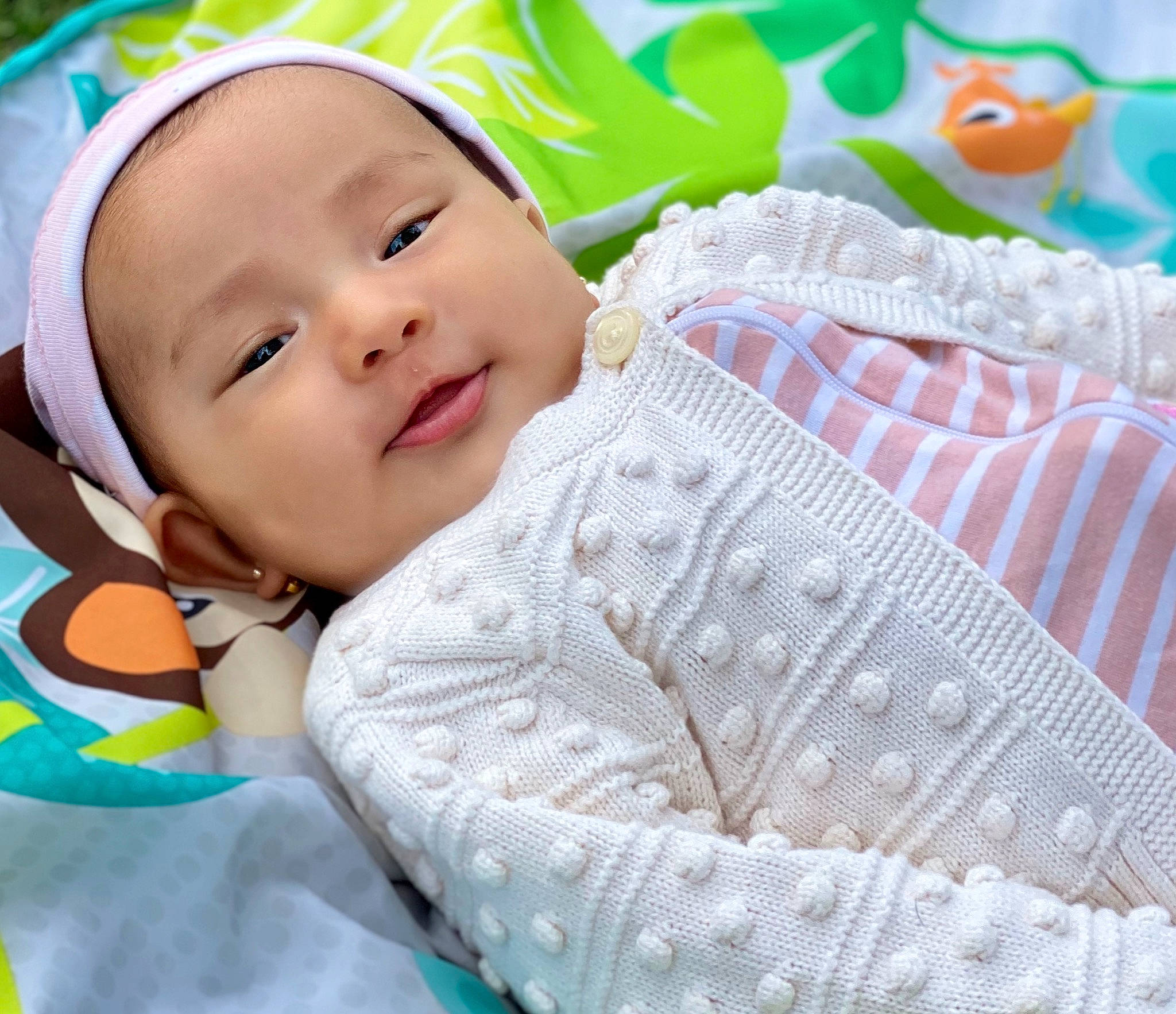 Aayra is registered to the contest to win money with this photo: baby, baby_products, baby_toddler_clothing, cheek, child, comfort, grass, green, happy, headgear, leisure, linens, magenta, pattern, person, pink, skin, sleeve, smile, textile