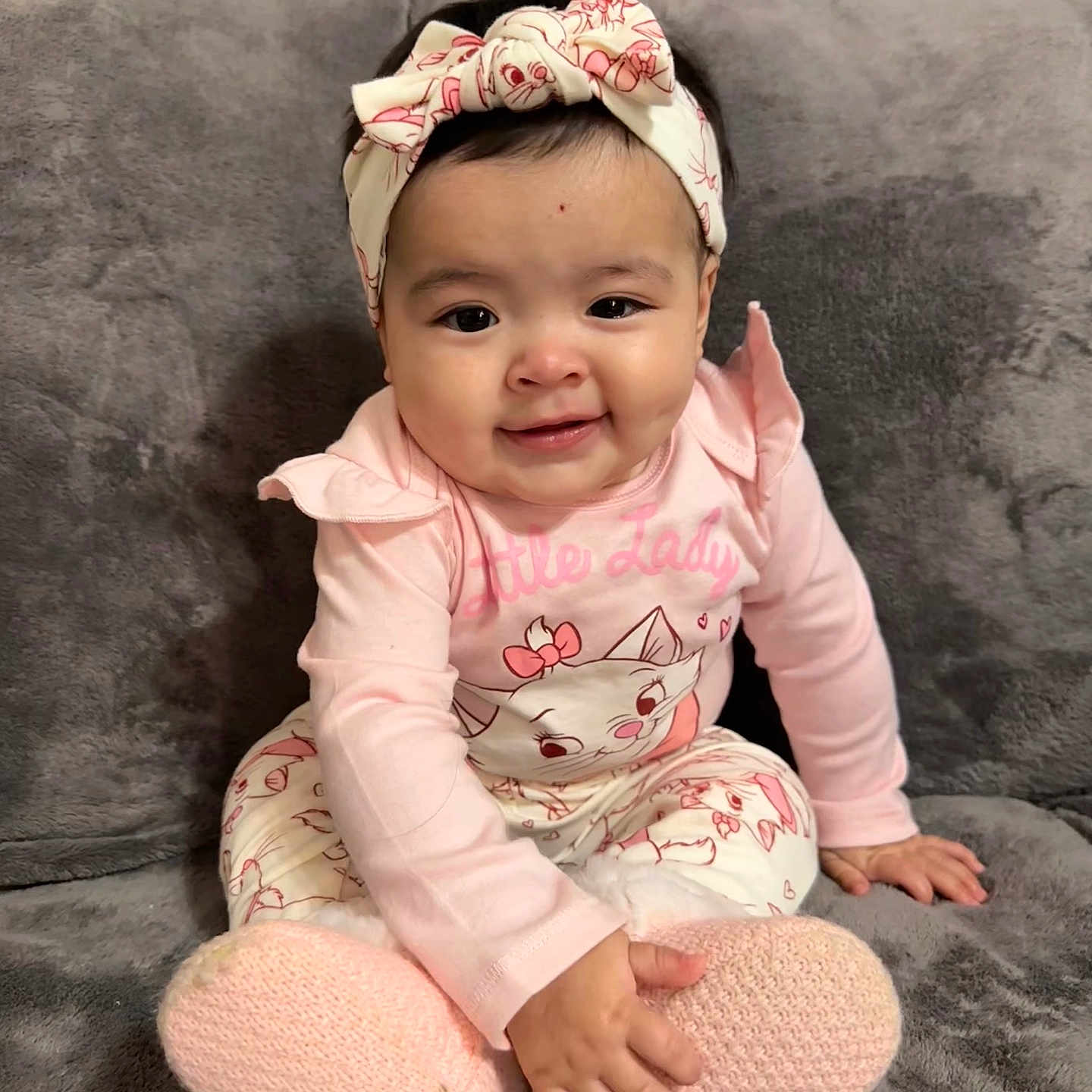Rosalynn joined the competition — help win amazing prizes! baby, babylaughing, clothing, couch, cushion, face, furniture, happy, hat, head, homedecor, hosiery, pants, person, photography, portrait, sitting, sleeve, smile, sock