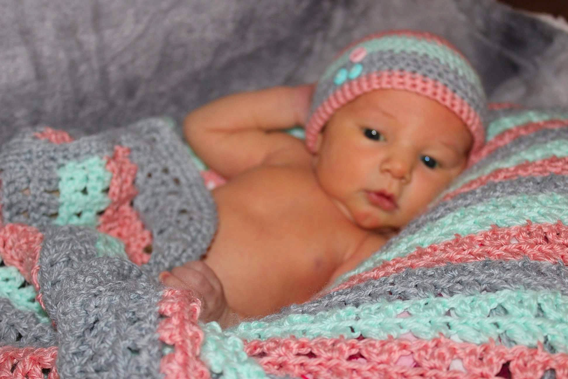 Lawsyn is registered to the contest to win money with this photo: cheek, child, crochet, girl, headgear, infant, knitting, mouth, nose, person, pink, skin, toddler