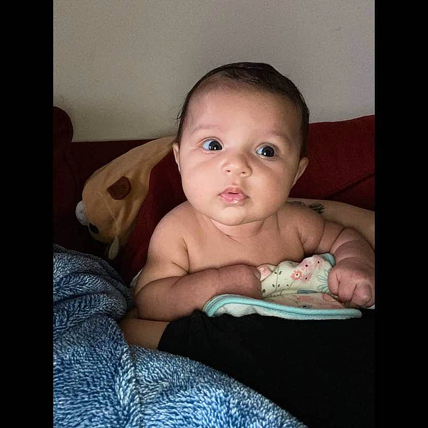 Amoré joined the competition — help win amazing prizes! abdomen, baby, baby_toddler_clothing, cheek, chest, child, comfort, darkness, eye, eyelash, face, flash_photography, happy, iris, linens, person, room, sitting, skin, sleeve