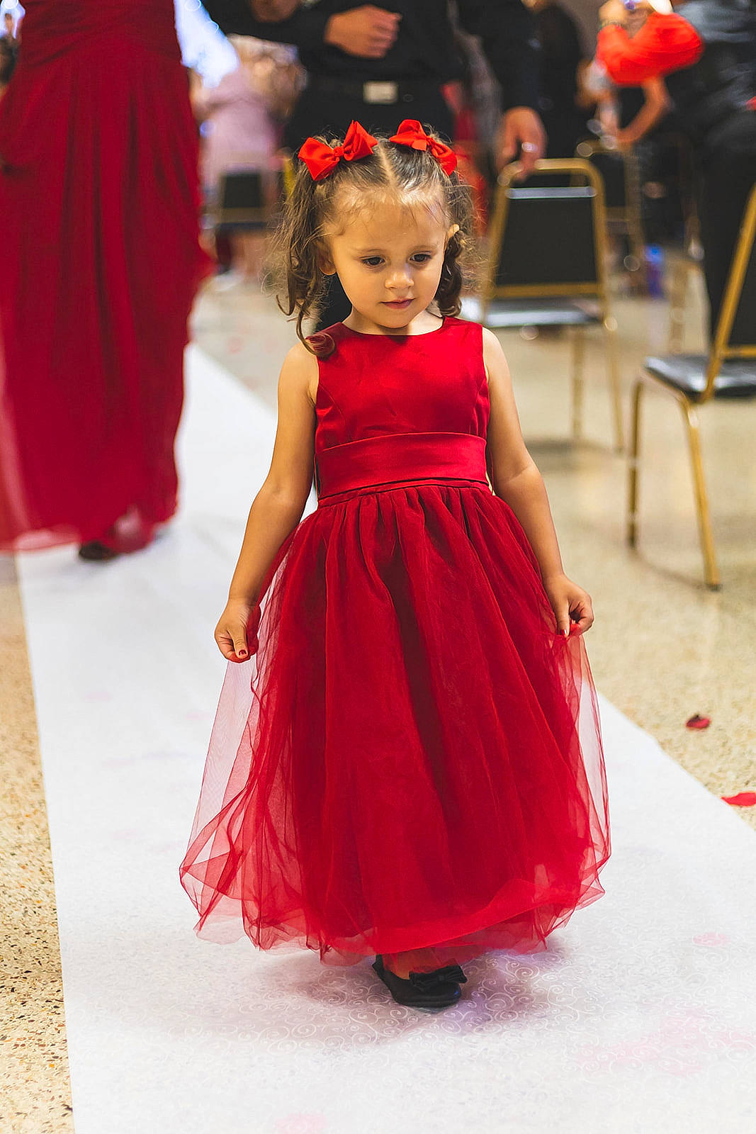 Nala is registered to the contest to win money with this photo: chair, clothing, day_dress, dress, entertainment, event, fashion_design, floor, flooring, formal_wear, gown, happy, joint, long_hair, magenta, one_piece_garment, performing_arts, person, thigh, toddler