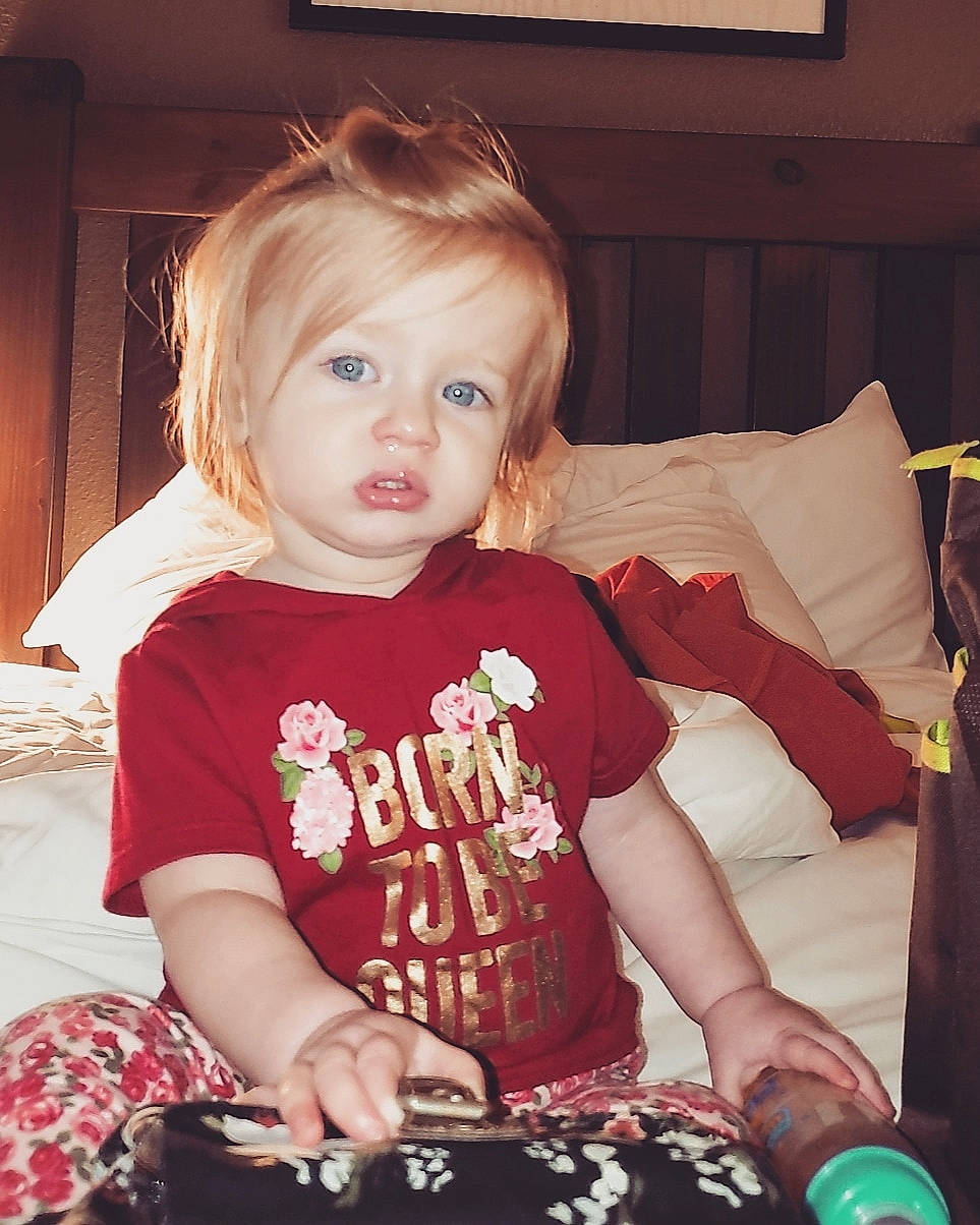 Mira is registered to the contest to win money with this photo: baby, blond, cheek, child, daughter, ear, eye, face, iris, person, play, sitting, toddler