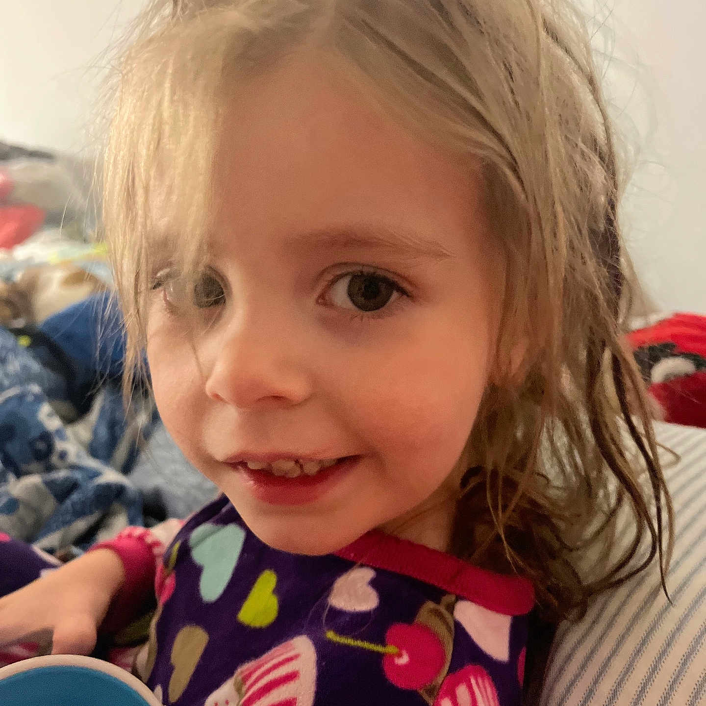 Joyce joined the competition — help win amazing prizes! blonde, bodypart, child, clothing, couch, face, female, finger, furniture, girl, hair, hand, happy, head, mouth, person, photography, portrait, smile, teeth