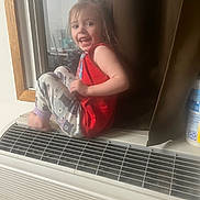 Joyce is registered to the contest to win money with this photo: airconditioner, appliance, bodypart, child, clothing, device, electricaldevice, face, female, finger, footwear, girl, hand, head, person, photography, portrait, shoe, shorts, sitting