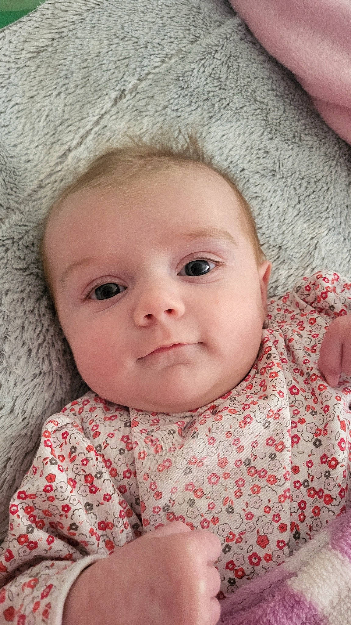 Lucia participe au concours pour gagner de l'argent avec cette photo : baby, baby_toddler_clothing, cheek, chin, eye, eyebrow, eyelash, face, facial_expression, finger, hairstyle, iris, lip, nose, person, pink, skin, sleeve, smile, textile