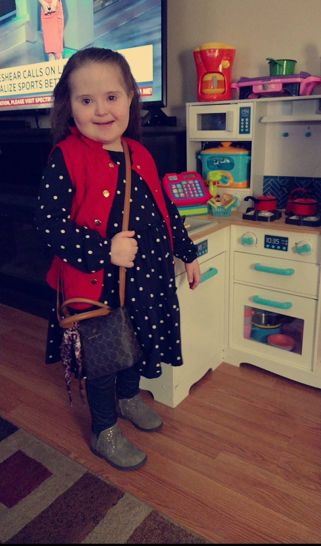 Audree is registered to the contest to win money with this photo: cabinetry, electric_blue, face, fashion_accessory, flooring, fun, home_appliance, joy, kitchen, kitchen_appliance, machine, major_appliance, pattern, person, refrigerator, room, sleeve, smile, standing, t_shirt