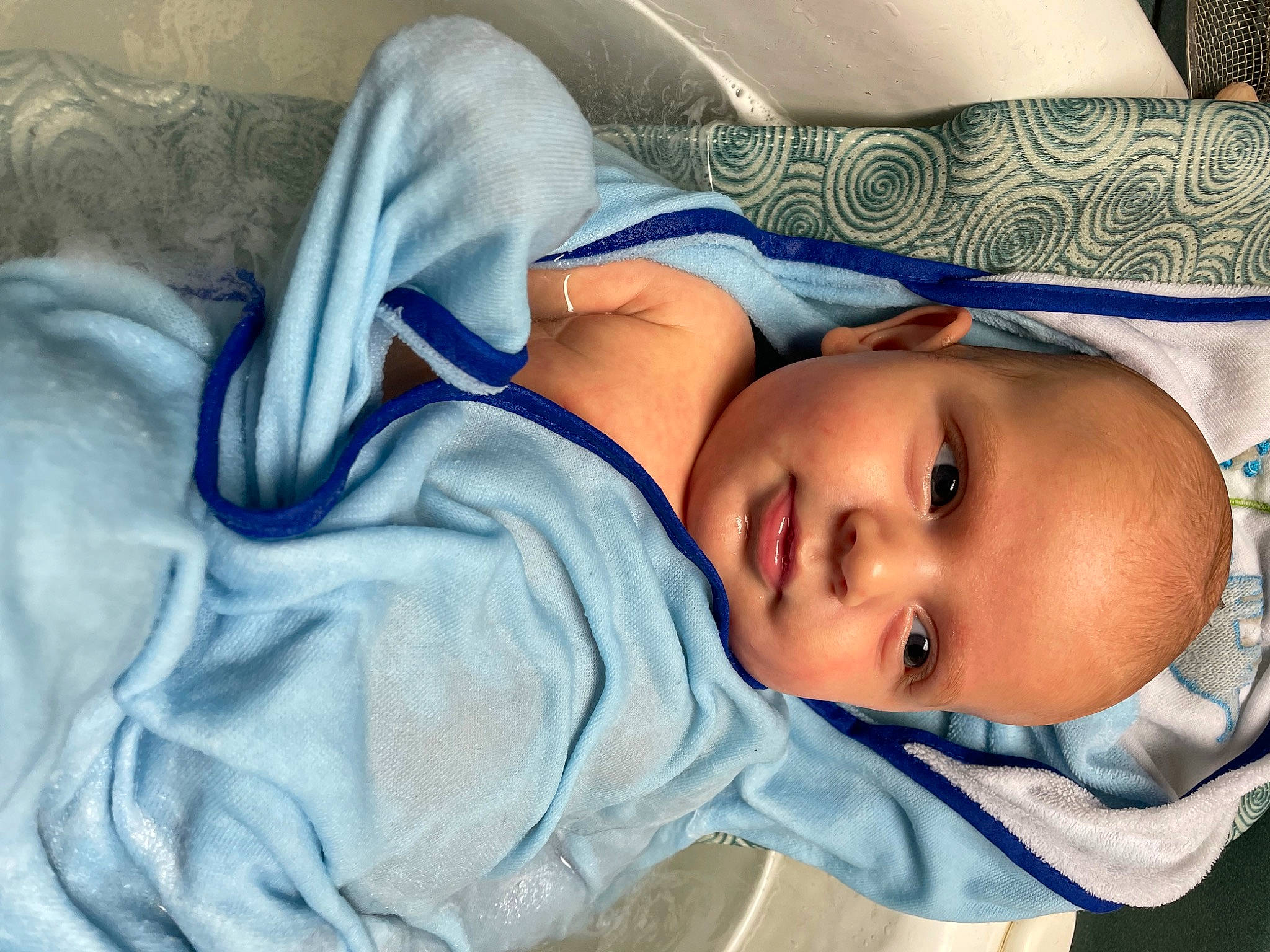 Jaxon is registered to the contest to win money with this photo: arm, baby, baby_toddler_clothing, cheek, chin, comfort, eye, eyebrow, head, headgear, human_body, iris, linens, lip, mouth, nose, person, sleeve, smile, textile