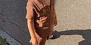 Gennaro participe au concours pour gagner de l'argent avec cette photo : boy, brown_clothing, casual, child, cracks, daytime, haircut, happy, outdoor, pavement, person, shadow, shirt, shoes, shorts, sidewalk, smiling, socks, standing, sunlight