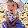 Makenzie is registered to the contest to win money with this photo: baby, infant, child, sun_hat, white_hat, smiling, beach, sand, blue_sky, ocean, sitting, cute, big_eyes, purple_pants, patterned_top, hands, toes, portrait, sunlight, happy