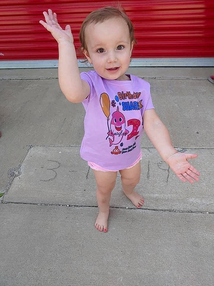 Kaisley is registered to the contest to win money with this photo: baby, baby_toddler_clothing, barefoot, cheek, chin, face, finger, floor, flooring, foot, happy, head, person, pink, road_surface, skin, sleeve, smile, t_shirt, thumb