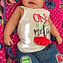Annalee is registered to the contest to win money with this photo: baby, infant, smiling, white_tank_top, watermelon_print, denim_shorts, patches, pink_blanket, pacifier, lying_down, cute, child, clothing, happy, drool, colorful, soft_texture, casual, indoors, portrait