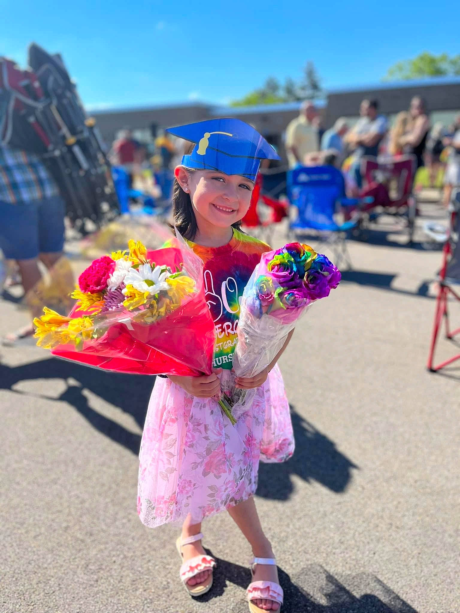 Kyah is registered to the contest to win money with this photo: city, crowd, dance, entertainment, event, fashion_accessory, flower, fun, happy, hat, headwear, joy, leisure, magenta, performing_arts, person, pink, plant, sky, street