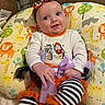 Adalynn joined the competition — help win amazing prizes! baby, child, infant, smiling, portrait, halloween, costume, bow, headband, pumpkin, striped_leggings, onesie, cushion, animal_pattern, giraffe, lion, elephant, indoor, sitting, happy