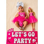 Samira is registered to the contest to win money with this photo: baby, tutu, headband, pink, doll, barbie, sign, party, dress, footwear, sandals, blanket, child, celebration, cute, portrait, happy, toy, fashion, accessory