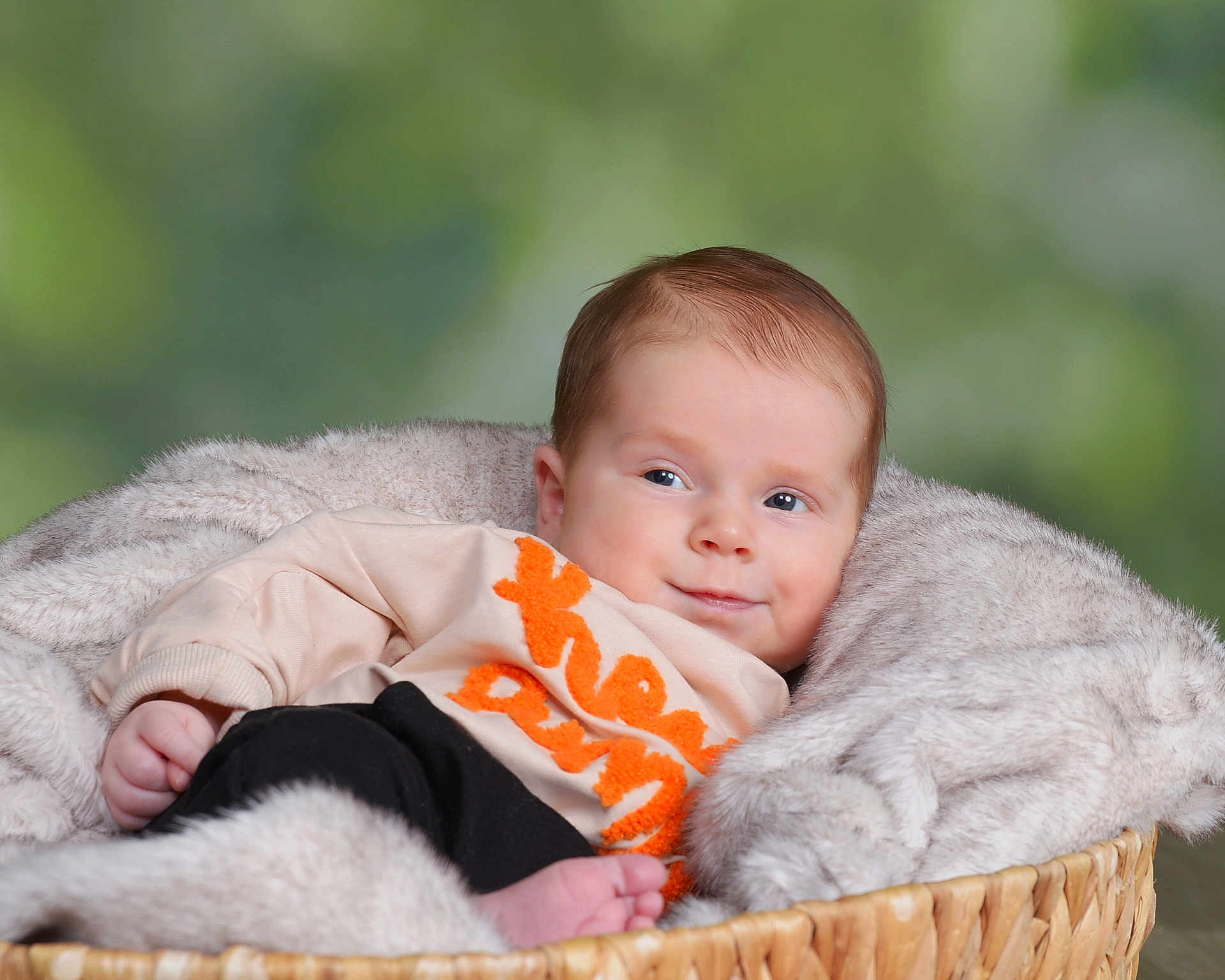 Soli joined the competition — help win amazing prizes! baby, basket, blanket, clothing, cozy, cute, face, furniture, infant, laying, looking_away, orange_text, person, portrait, relaxing, sweater, toddler, warm, wooden, young_child