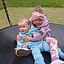 child, baby, swing, playground, outdoor, grass, hug, smile, cute, blue_clothing, headband, jacket, leggings, shoes, toy, happy, park, siblings, play, toddler