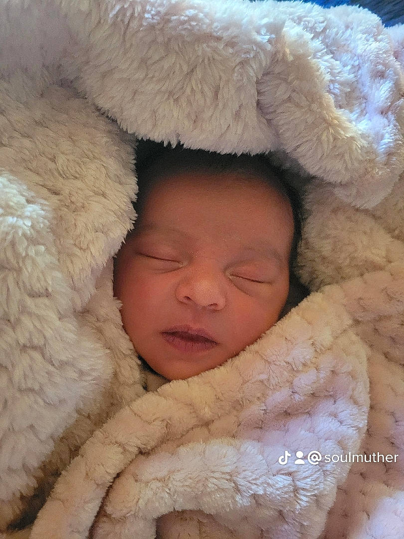 Clara joined the competition — help win amazing prizes! baby, baby_sleeping, child, comfort, fur, fur_clothing, happy, headgear, linens, nose, pattern, peach, portrait_photography, skin, smile, textile, thumb, toddler, wool