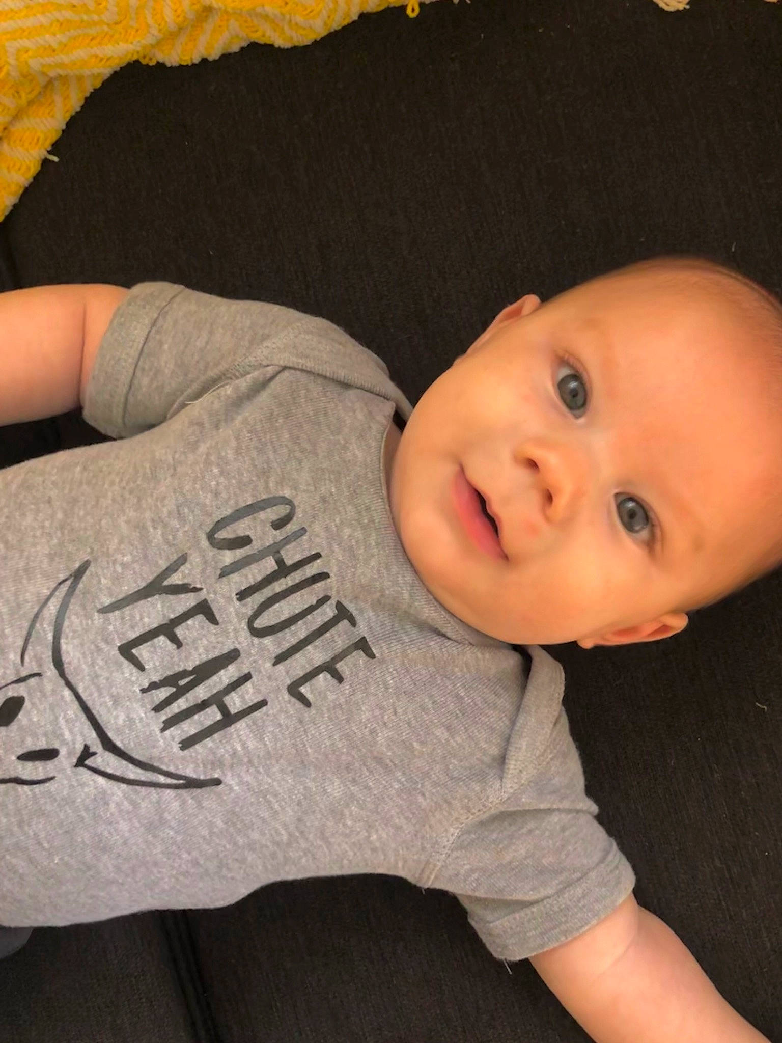 Bryer is registered to the contest to win money with this photo: arm, baby, cheek, child, chin, finger, head, nose, person, skin, toddler