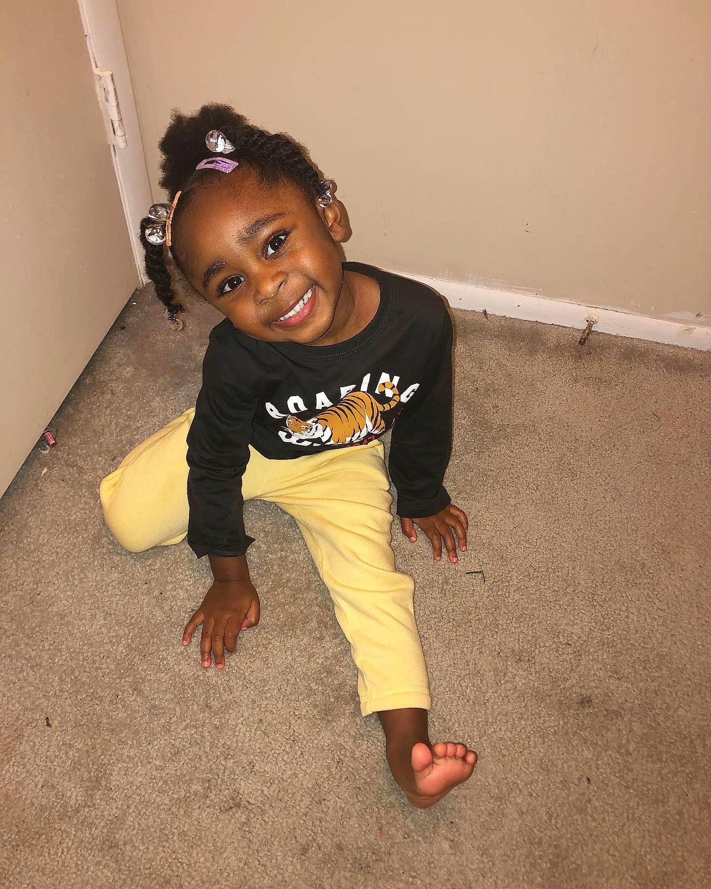 Melani is registered to the contest to win money with this photo: arm, baby_toddler_clothing, cheek, chin, clothing, eye, face, facial_expression, hair, hairstyle, happy, head, human_body, joint, joy, leg, person, skin, sleeve, smile