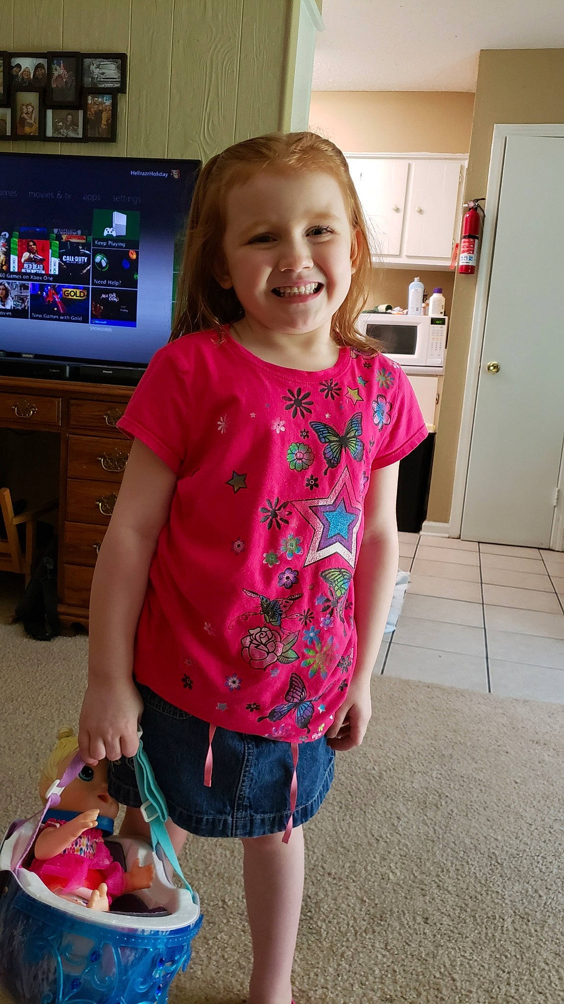Danica is registered to the contest to win money with this photo: child, clothing, fun, jeans, joy, outerwear, pattern, person, pink, play, shirt, shorts, shoulder, sleeve, smile, standing, summer, t_shirt, textile, toddler