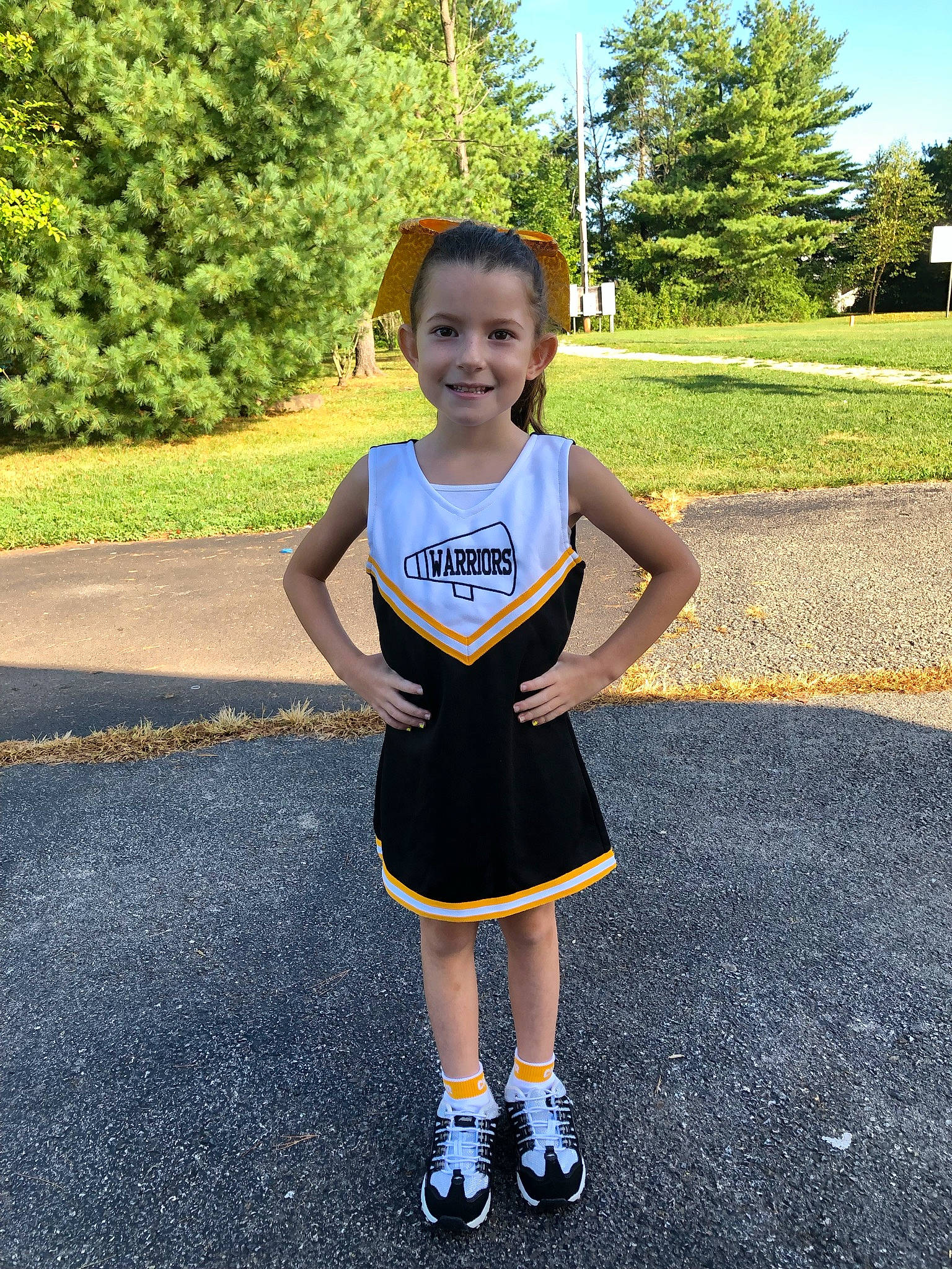Giavanna joined the competition — help win amazing prizes! asphalt, cheerleading_uniform, child, electric_blue, fun, gesture, grass, happy, head, human_leg, joy, leisure, person, plant, recreation, road_surface, smile, sportswear, t_shirt, toddler