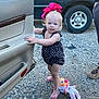 Nova joined the competition — help win amazing prizes! toddler, child, pink_bow, car_door, doll, gravel, flip_flops, black_car, toy, outdoor, person, standing, young_child, blue_eyes, shorts, summer_clothing, hair_bow, vehicle, adult_leg, playtime