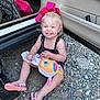 Nova joined the competition — help win amazing prizes! toddler, child, smile, pink_bow, unicorn_toy, car_door, rocks, sandals, outdoor, happy, playful, cute, person, footwear, gravel, seat, clothing, blonde_hair, toy, summer