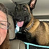 Jeep joined the competition — help win amazing prizes! adult, black_fur, brown_fur, canine, car, closeup, collar, dog, glasses, happy, headrest, human_face, indoor, person, pet, seat, seat_cover, side_view, tongue_out, window