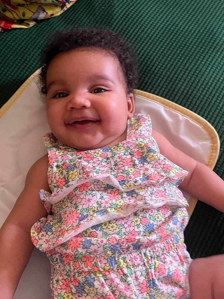 Mila is registered to the contest to win money with this photo: arm, cheek, chin, eyebrow, facial_expression, forehead, hair, hand, happy, head, human, human_body, joy, lip, mouth, neck, nose, organ, person, skin