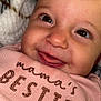 Oaklynn joined the competition — help win amazing prizes! baby, smiling, face, closeup, child, pink_clothing, text_on_clothing, blanket, zebra_pattern, happy, infant, cute, cheeks, eyes, mouth, tongue, soft_texture, portrait, indoors, cozy