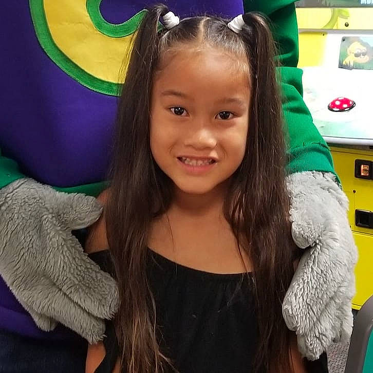 Chrislynn joined the competition — help win amazing prizes! brown_hair, child, child_model, ear, face, forehead, fun, hair, hair_accessory, hair_coloring, hairstyle, happy, head, human, iris, joy, long_hair, organ, person, purple