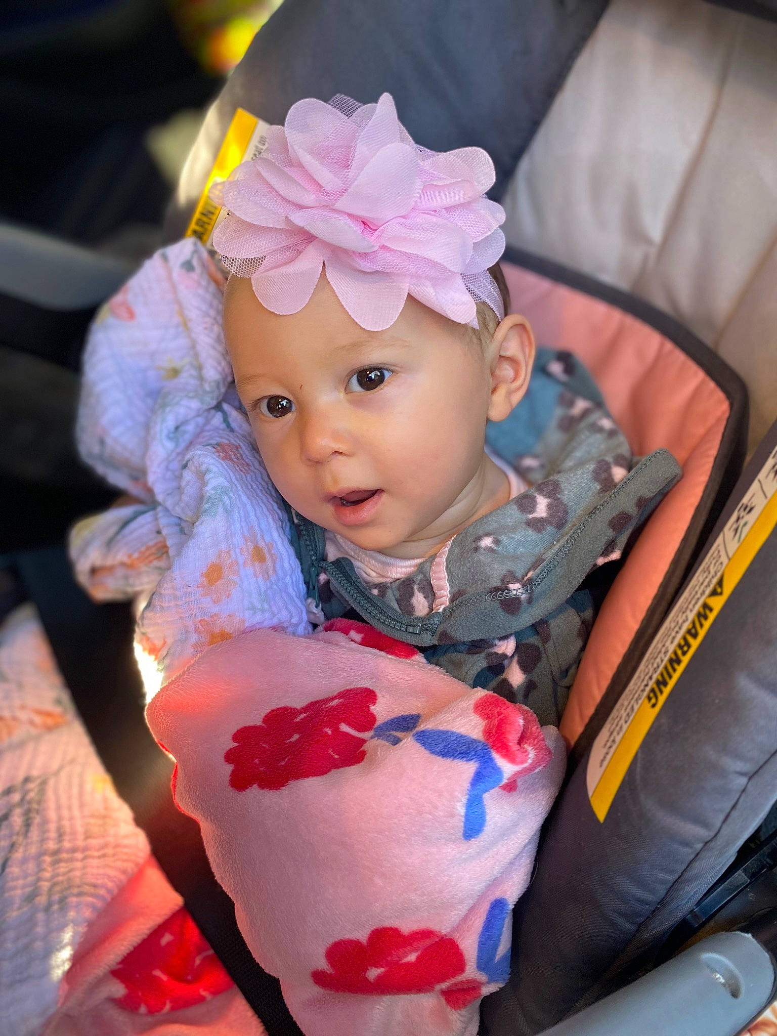 Emersyn is registered to the contest to win money with this photo: baby, baby_products, baby_toddler_clothing, cheek, costume_hat, dress, eye, eyelash, fashion_accessory, fun, headband, headpiece, headwear, iris, jewellery, lip, magenta, pattern, person, pink
