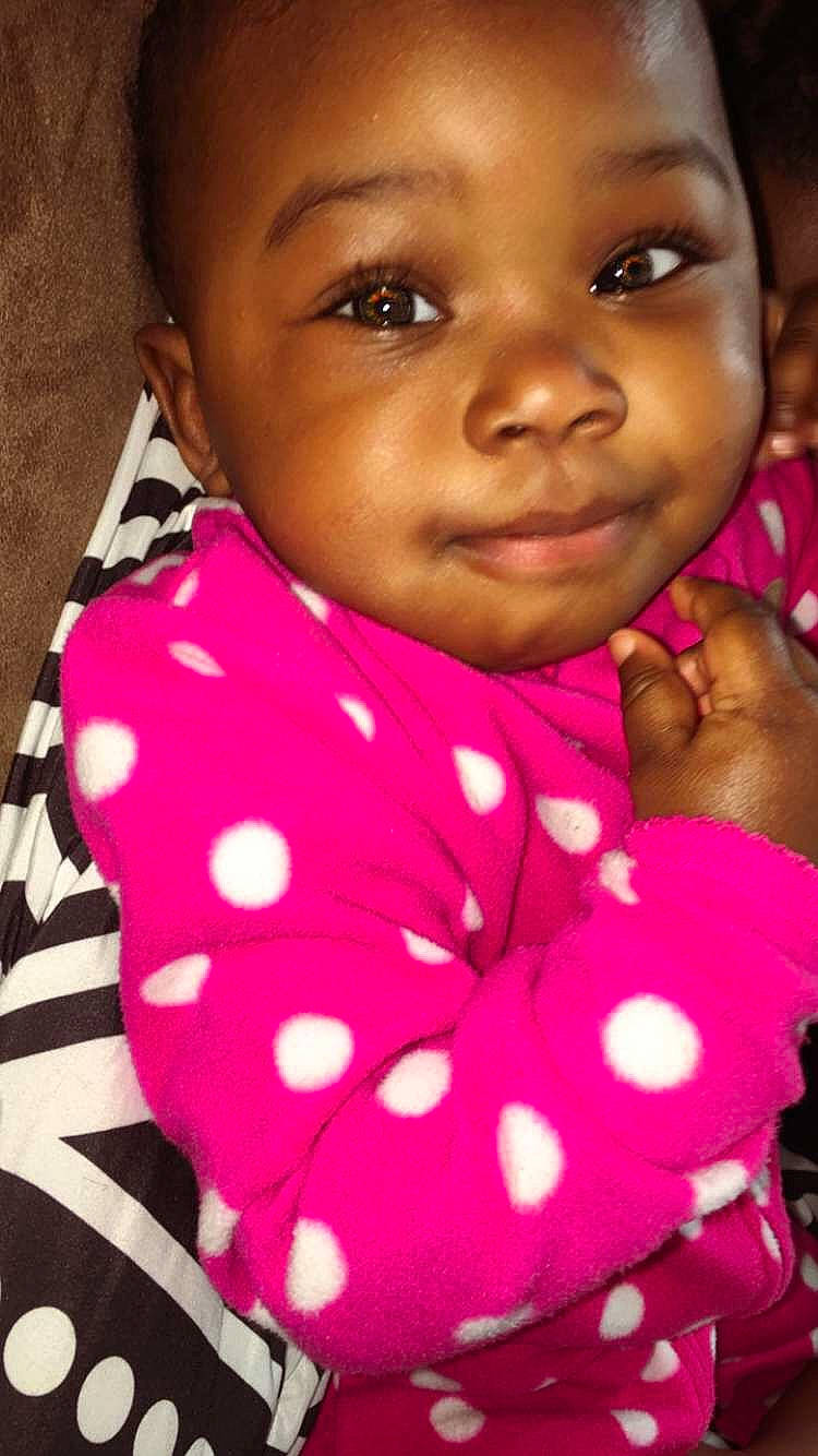 Zendaya is registered to the contest to win money with this photo: baby_toddler_clothing, black, black_hair, cheek, chin, eyebrow, eyelash, face, happy, iris, lip, nose, organ, person, pink, red, skin, sleeve, smile, toddler