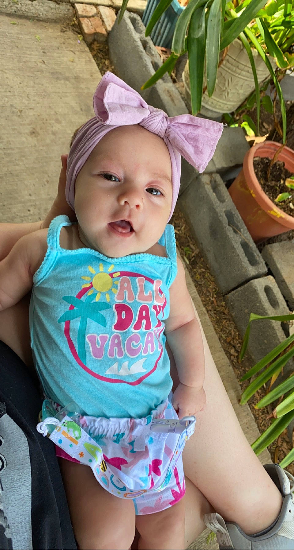 Vivianna joined the competition — help win amazing prizes! baby, baby_toddler_clothing, cheek, chin, cool, face, flowerpot, grass, hairstyle, happy, head, headwear, houseplant, mouth, neck, person, pink, plant, product, skin