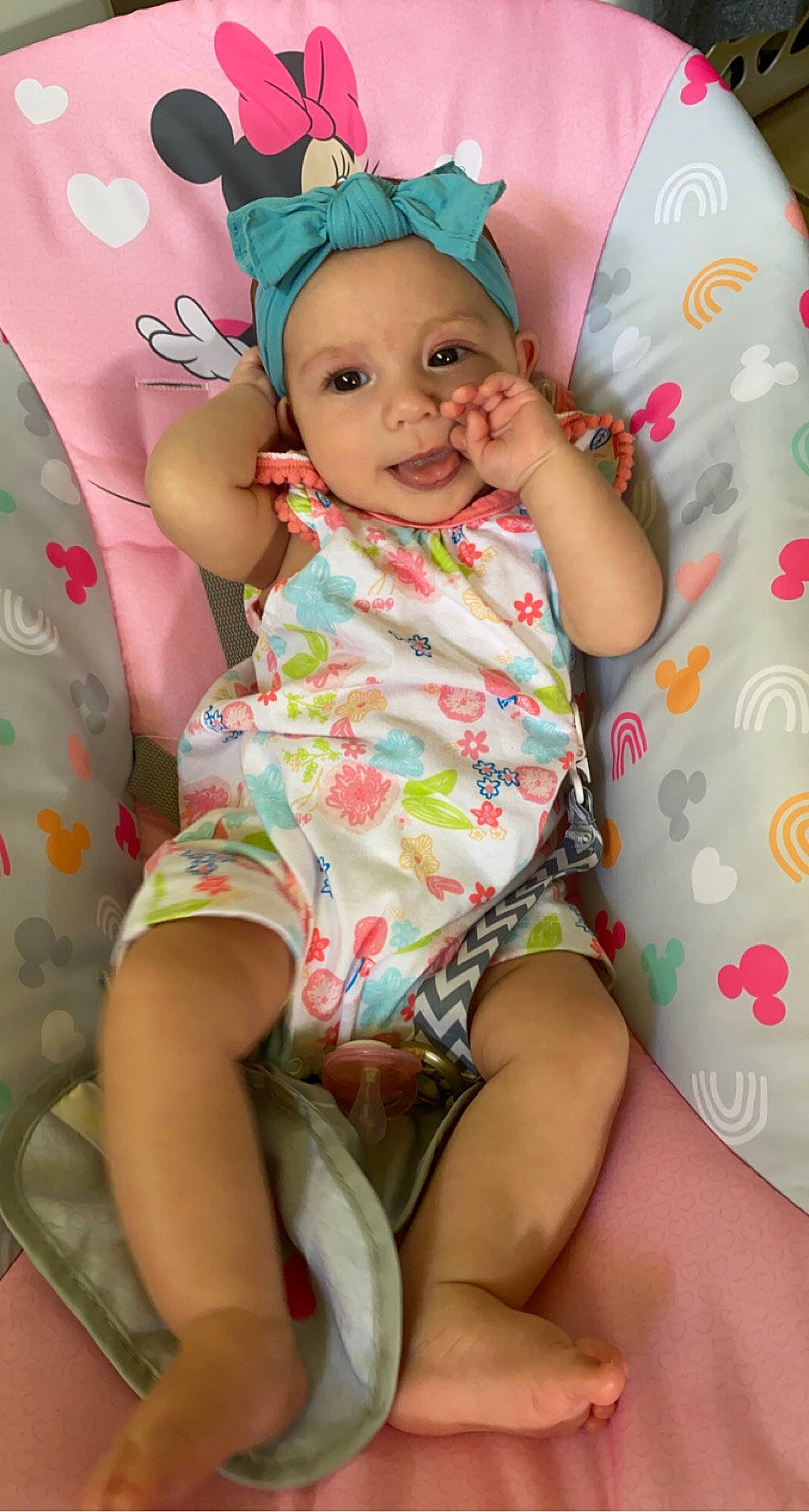 Vivianna is registered to the contest to win money with this photo: baby, baby_toddler_clothing, cap, cheek, comfort, eye, face, finger, happy, head, headwear, person, pink, purple, skin, sleeve, smile, t_shirt, textile, thigh