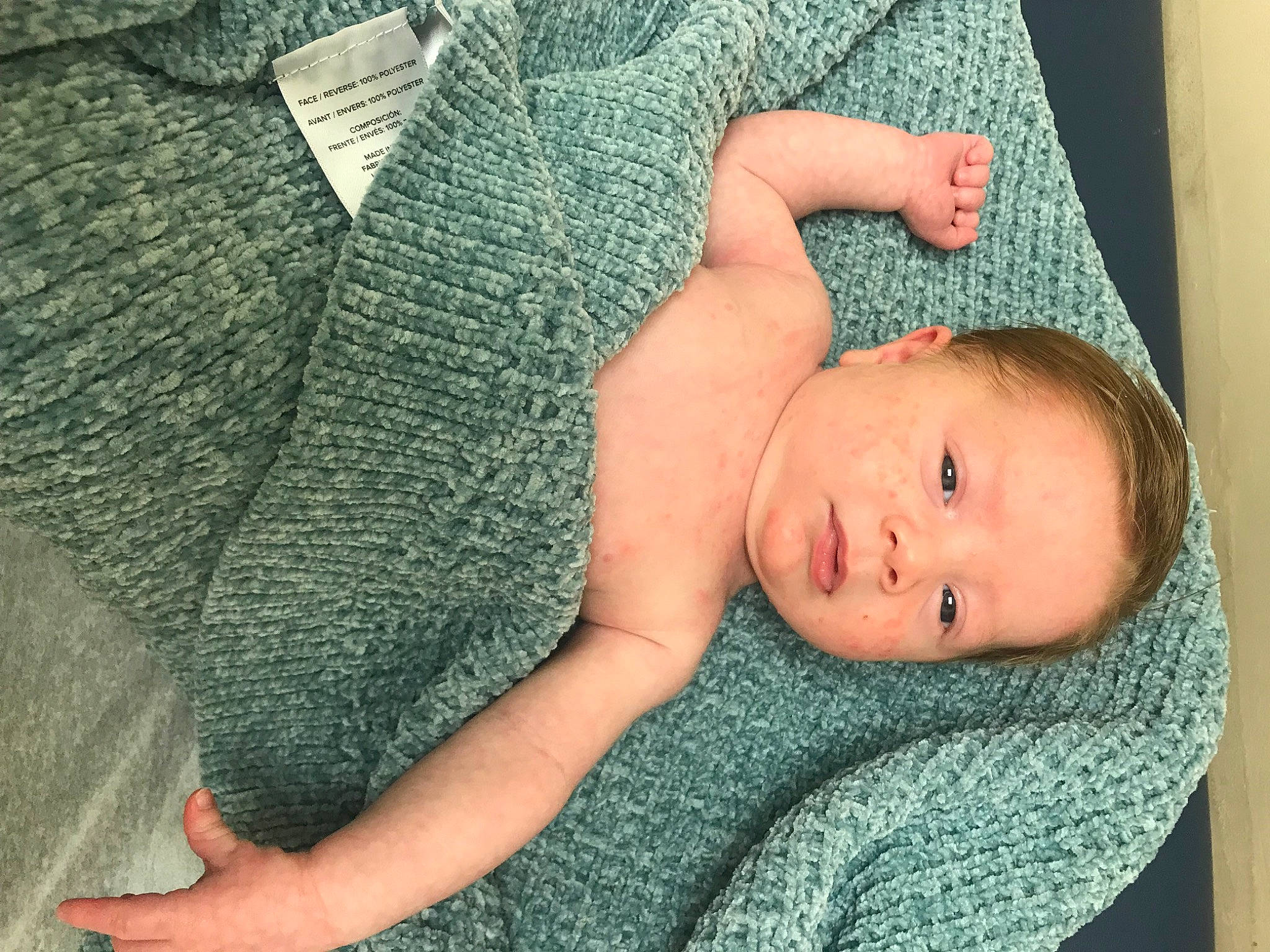 Bodhi joined the competition — help win amazing prizes! arm, azure, baby, baby_products, baby_toddler_clothing, bedding, cheek, child, comfort, eye, finger, grass, hand, headgear, linens, person, skin, textile, toddler, wood