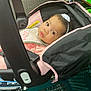 Jordynn joined the competition — help win amazing prizes! baby, child, car_seat, infant, shopping_cart, store, aisle, shoes, sneakers, headband, curly_hair, pink, black, clothing, person, face, portrait, indoor, retail, curious