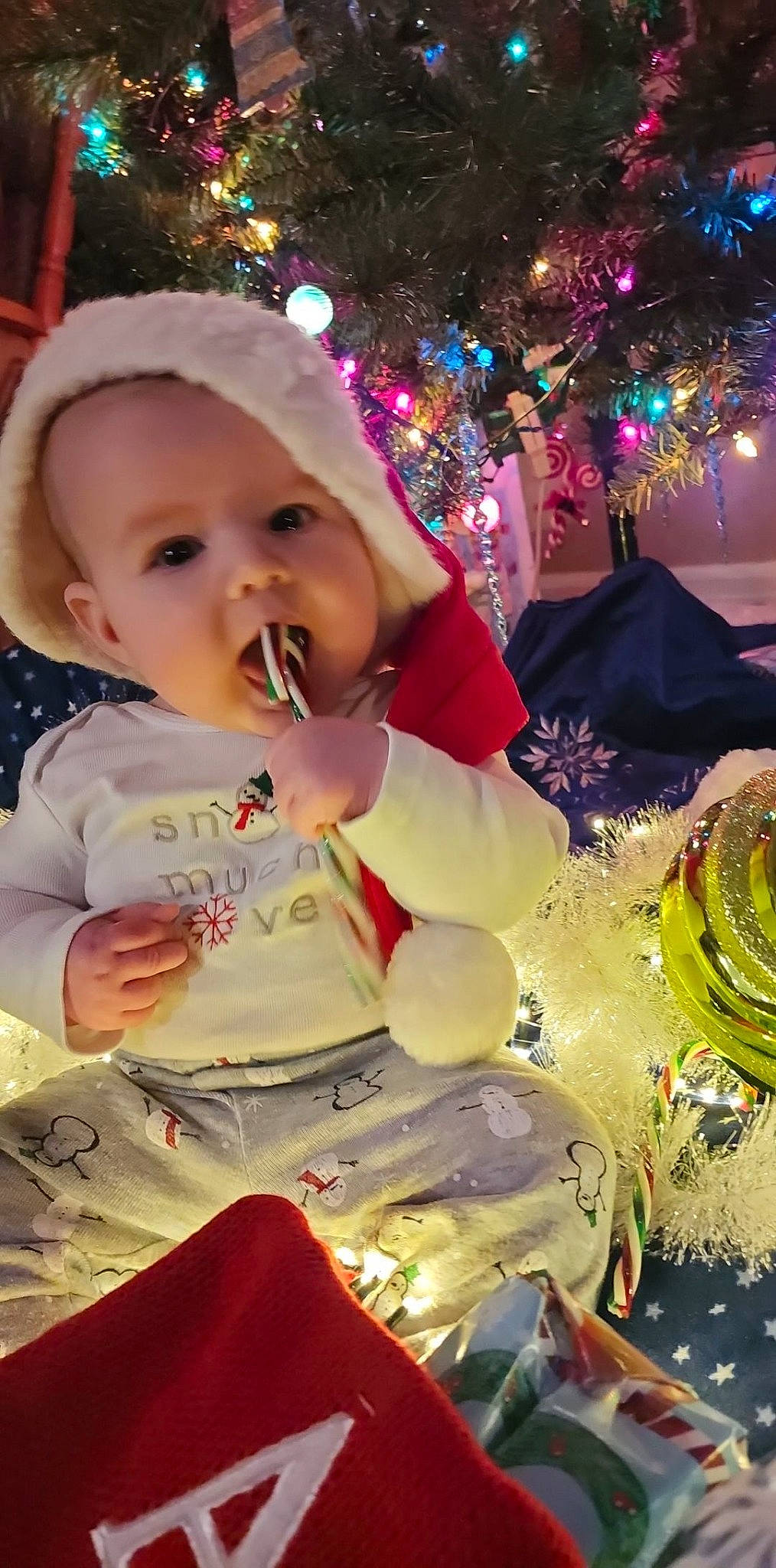 Atlas is registered to the contest to win money with this photo: baby, baby_toddler_clothing, beauty, cheek, child, christmas, christmas_decoration, christmas_eve, christmas_ornament, christmas_tree, event, fun, happy, holiday, holiday_ornament, light, ornament, person, toddler, tradition