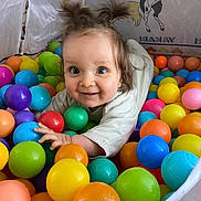 Cassie participe au concours pour gagner de l'argent avec cette photo : toddler, child, ball_pit, colorful_balls, playtime, happy, smiling, pigtails, indoor, cute, portrait, fun, toy, plastic_balls, crawling, play_area, bright_colors, young_child, joyful, cartoon_background