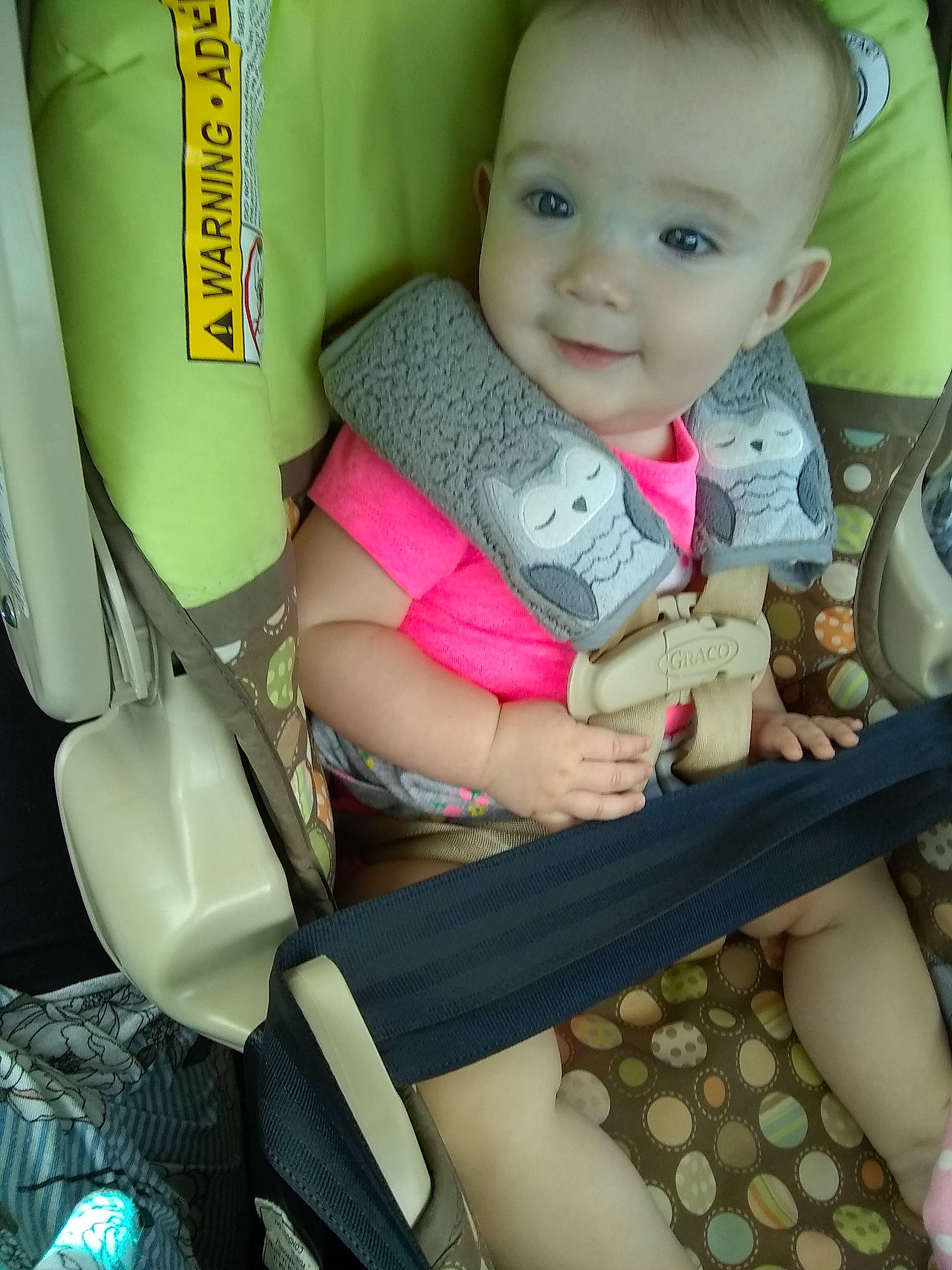 Astrid is registered to the contest to win money with this photo: arm, baby_carriage, baby_products, car_seat, child, day, finger, girl, infant, joy, leg, person, product, sitting, skin, snapshot, toddler