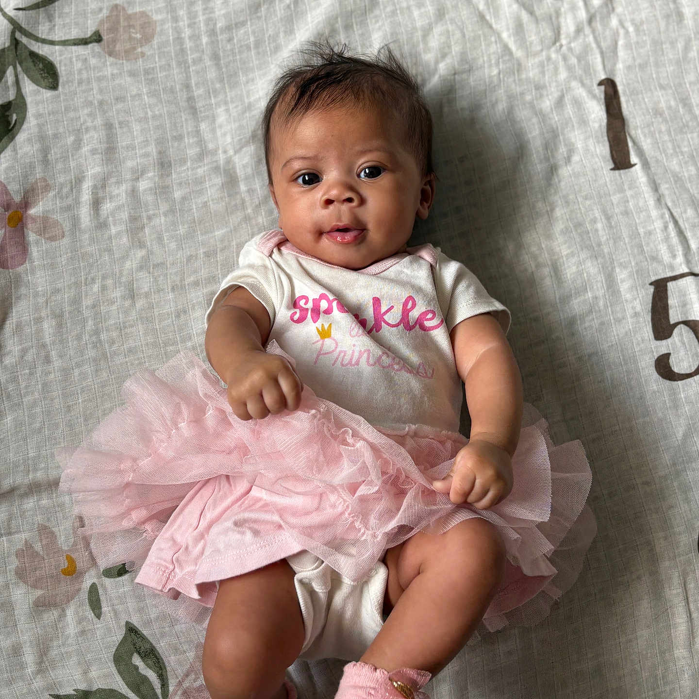 Zya is registered to the contest to win money with this photo: baby, bodypart, clothing, couch, dress, eveningdress, face, finger, footwear, formalwear, furniture, hand, head, homedecor, linen, person, photography, portrait, sandal, sitting