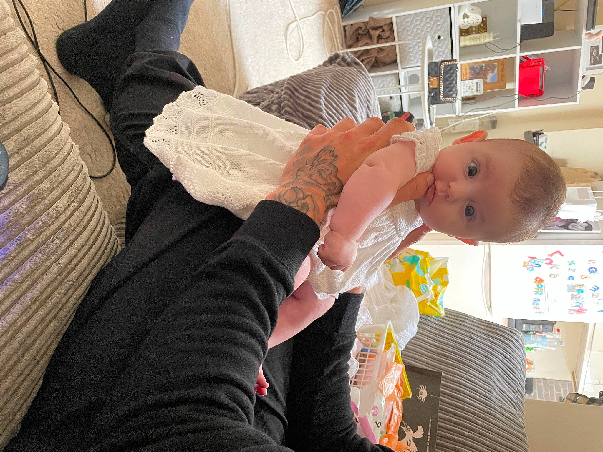 Karina is registered to the contest to win money with this photo: abdomen, baby, baby_products, child, comfort, elbow, event, gesture, happy, hospital, house, human_leg, person, refrigerator, room, shelf, shelving, sitting, toddler, wrist